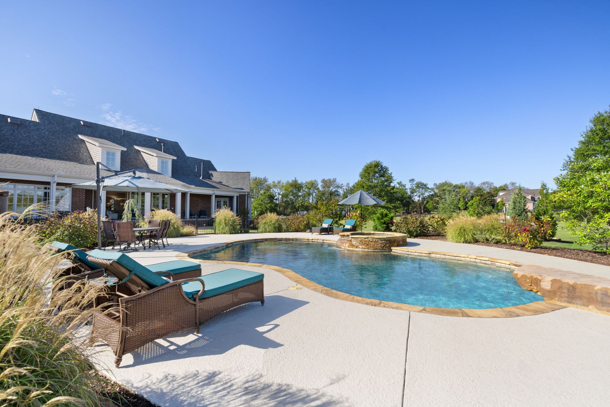 4219 Two Rivers Lane Franklin, TN 37069 - Photo 58 of 69 a view of a swimming pool with lounge chairs in patio