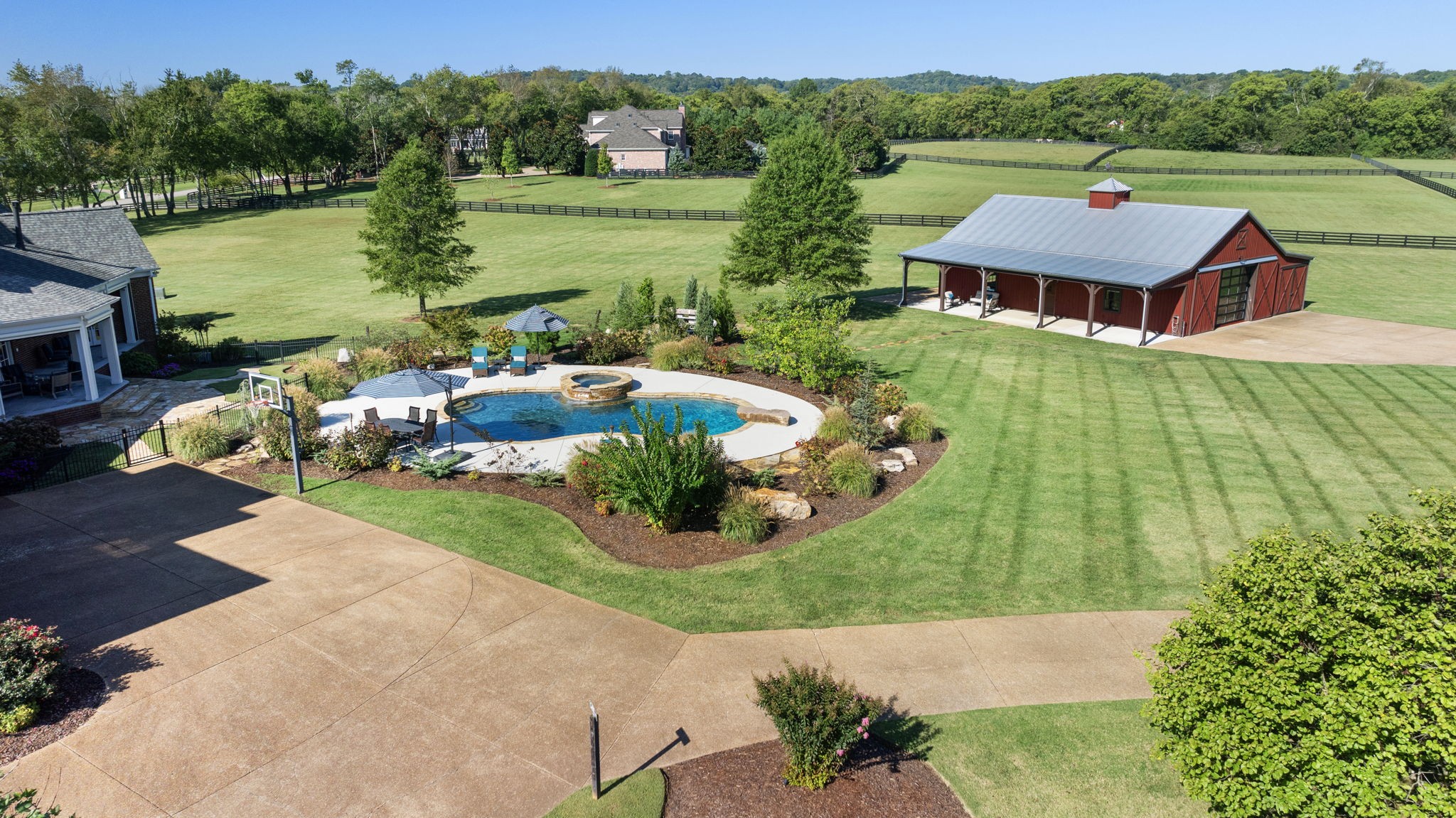 4219 Two Rivers Lane Franklin, TN 37069 - Photo 67 of 69 an aerial view of a house with outdoor space swimming pool and lake view