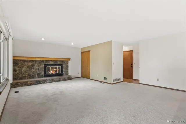 an empty room with fireplace