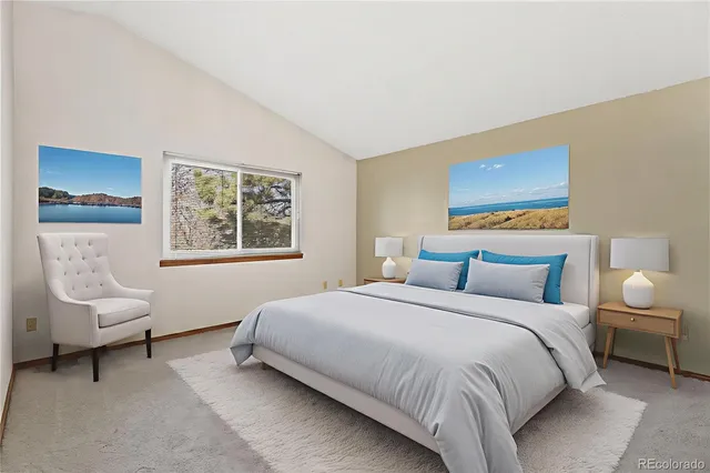 a bedroom with a bed and a couch