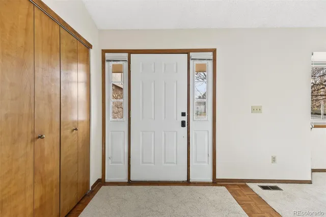 a view of front door with a hallway