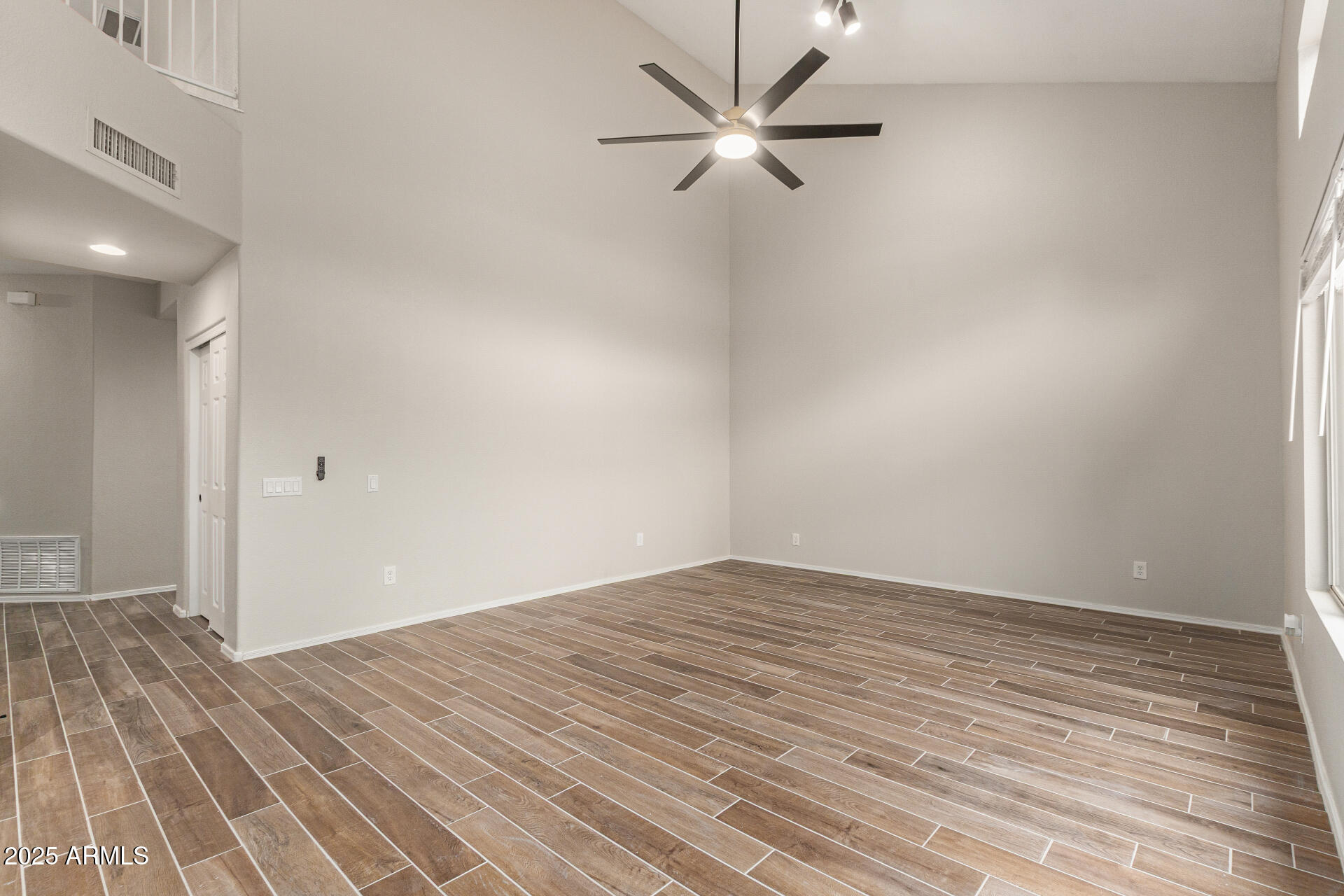 4522 East Rowel Road Phoenix, AZ 85050 - Photo 12 of 49 a view of empty room with wooden floor