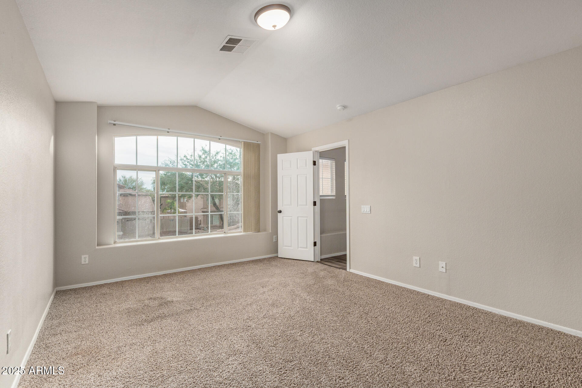 4522 East Rowel Road Phoenix, AZ 85050 - Photo 24 of 49 a view of an empty room with a window