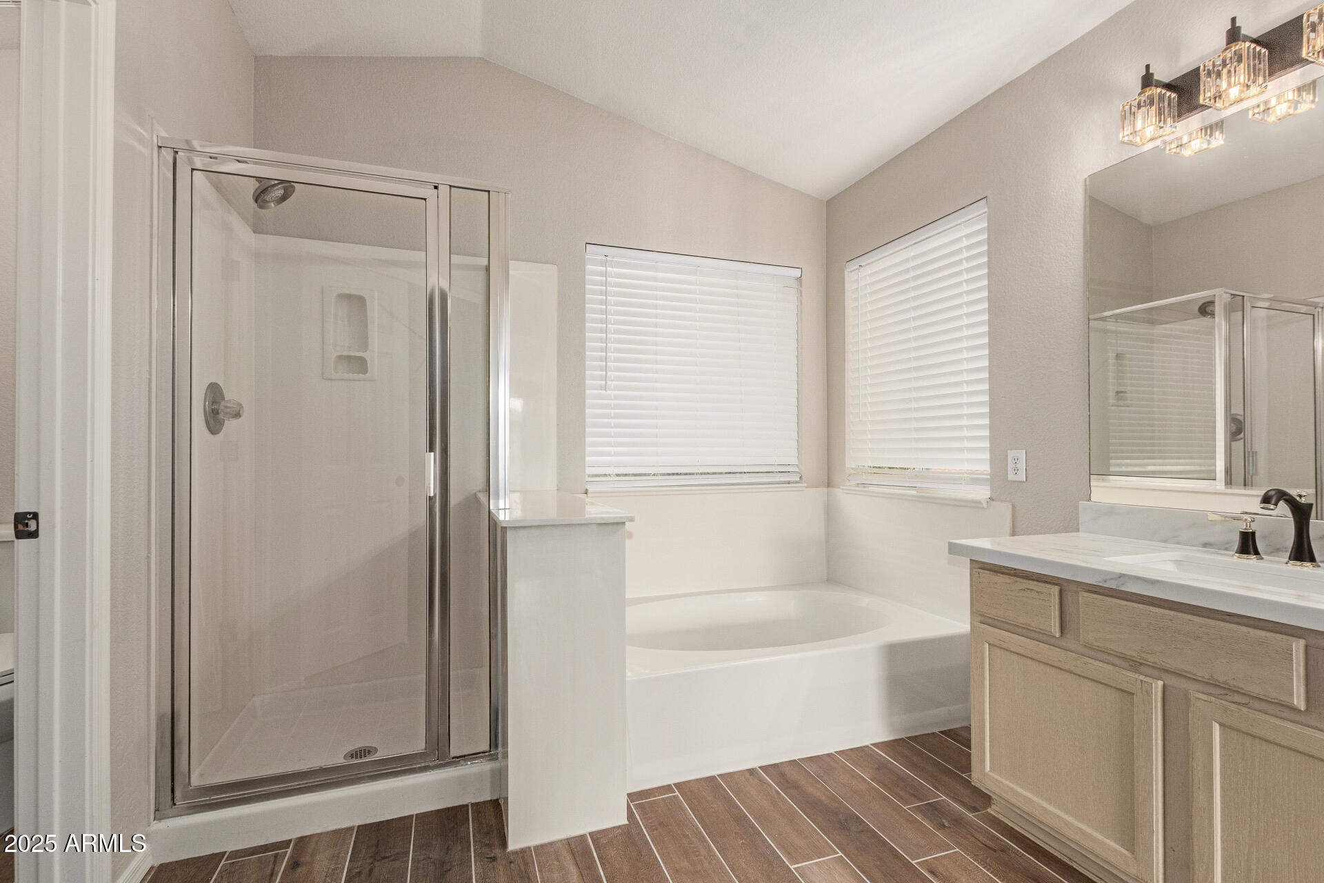 4522 East Rowel Road Phoenix, AZ 85050 - Photo 28 of 49 a bathroom with a tub sink and mirror