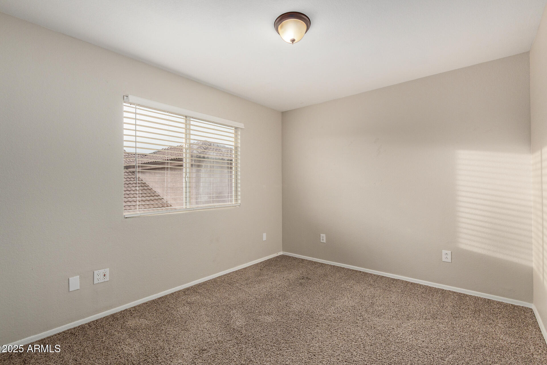 4522 East Rowel Road Phoenix, AZ 85050 - Photo 30 of 49 an empty room with windows