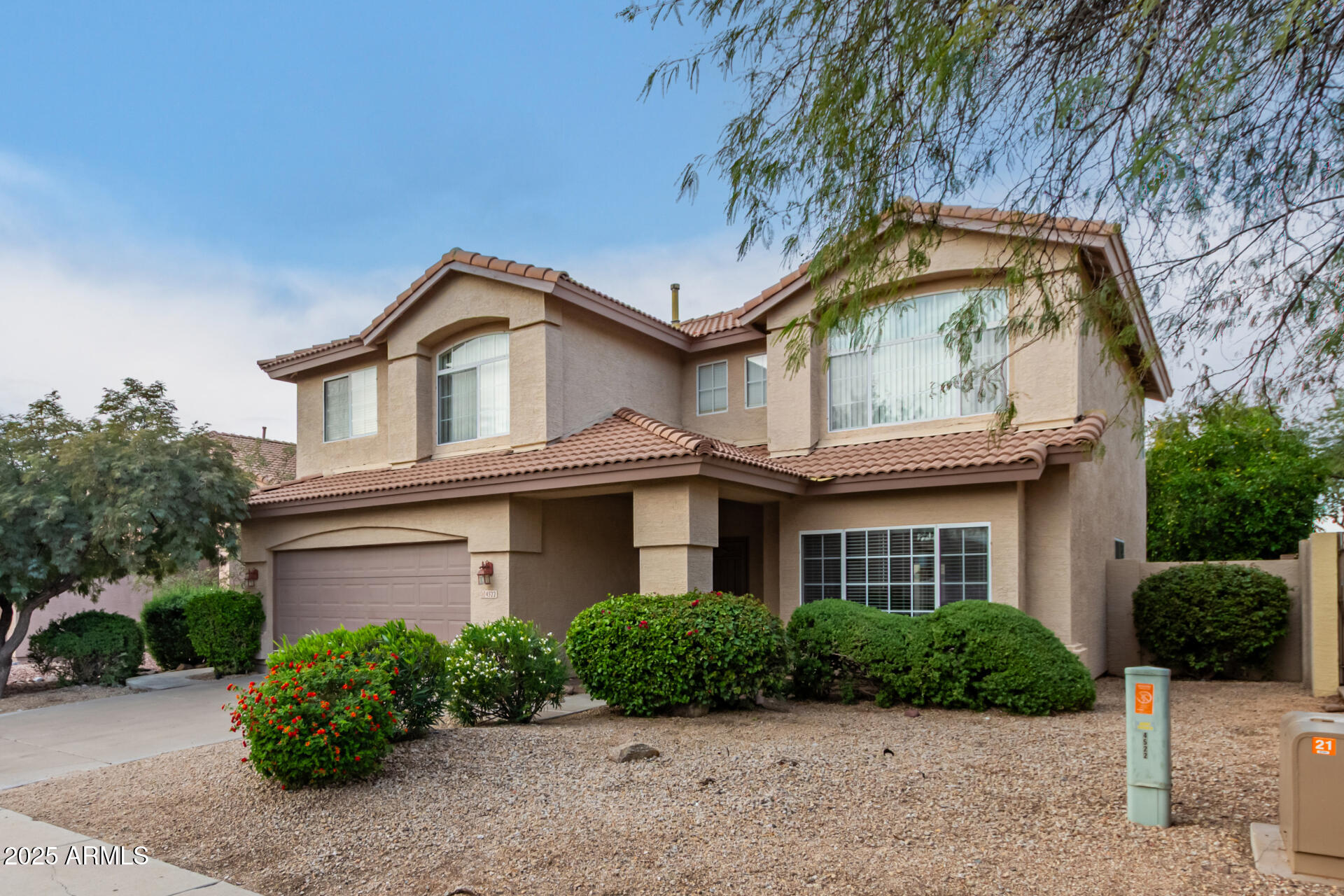 4522 East Rowel Road Phoenix, AZ 85050 - Photo 3 of 49 a front view of a house with a garden