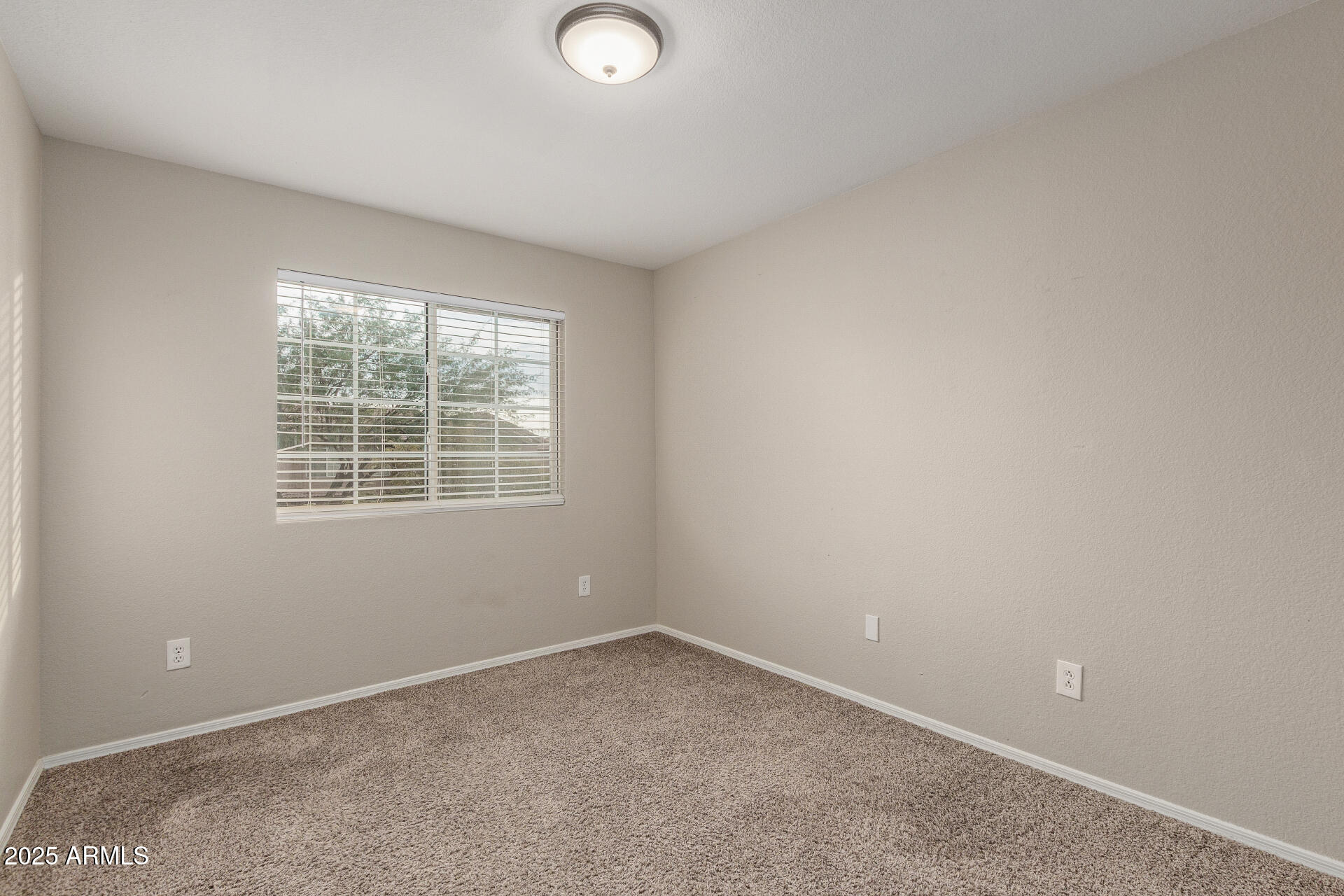 4522 East Rowel Road Phoenix, AZ 85050 - Photo 32 of 49 an empty room with a window
