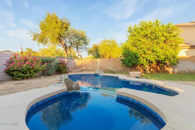 a swimming pool with wooden fence