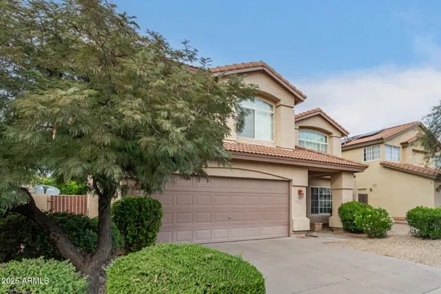 front view of a house with a street