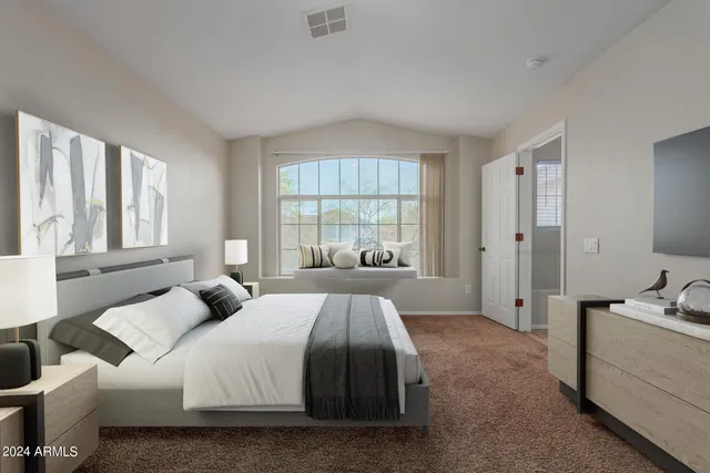 a bed room with a bed and a window