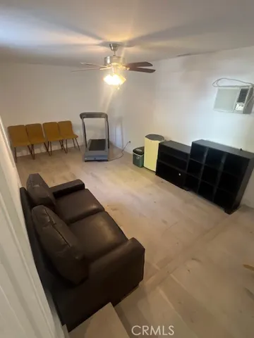 a bedroom with a bed and a chair