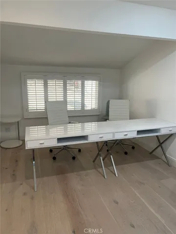 a bedroom with a bed and chair