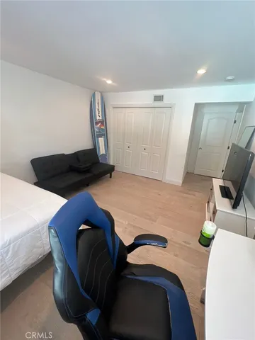 a view of a street with trees on both side of it