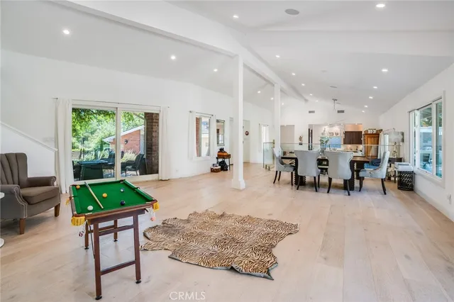 a living room with furniture and a table