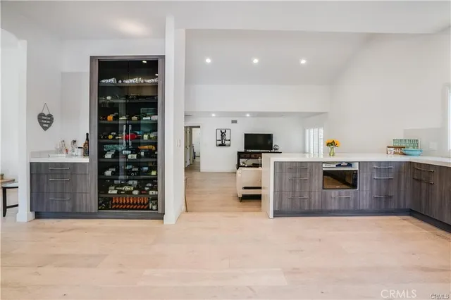 a kitchen with a refrigerator and a counter top space