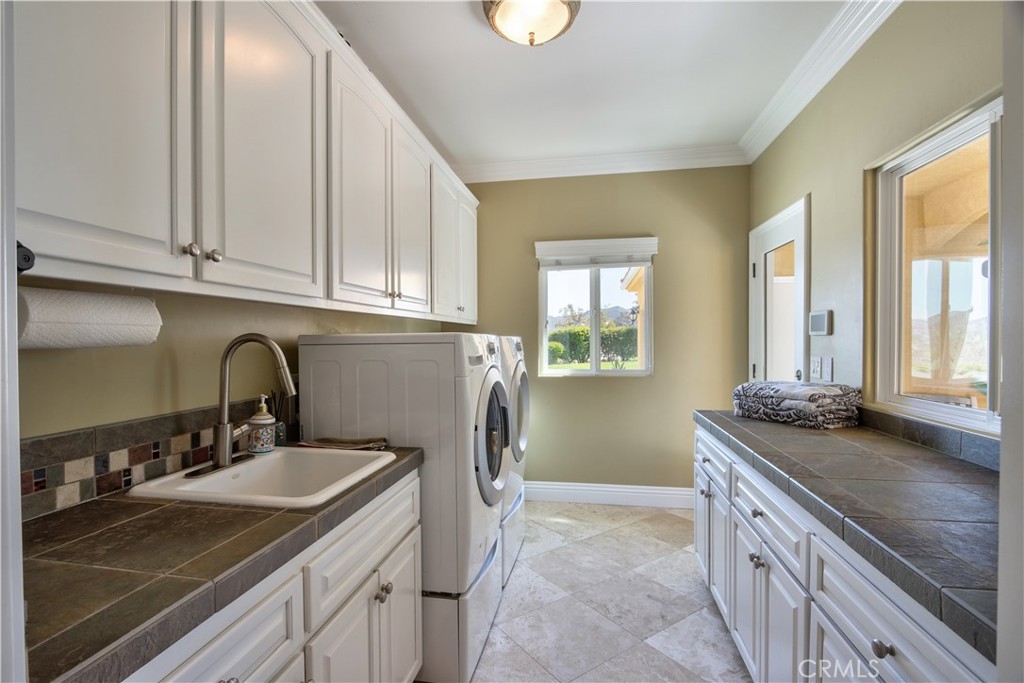 35445 Linda Rosea Road Temecula, CA 92592 - Photo 11 of 21 a kitchen with granite countertop a sink and cabinets