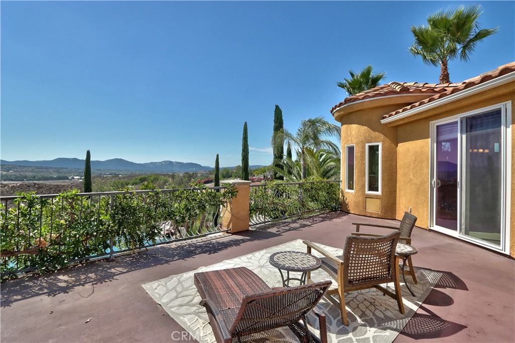 35445 Linda Rosea Road Temecula, CA 92592 - Photo 15 of 21 a view of a patio with table and chairs and potted plants