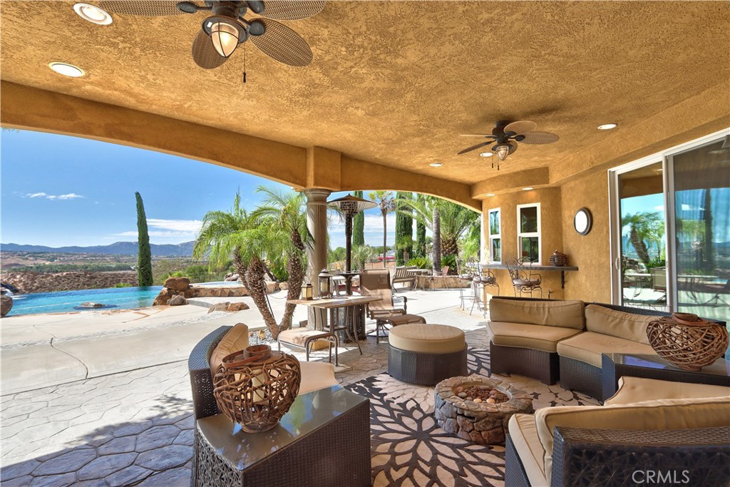 35445 Linda Rosea Road Temecula, CA 92592 - Photo 17 of 21 a living room with furniture and a floor to ceiling window