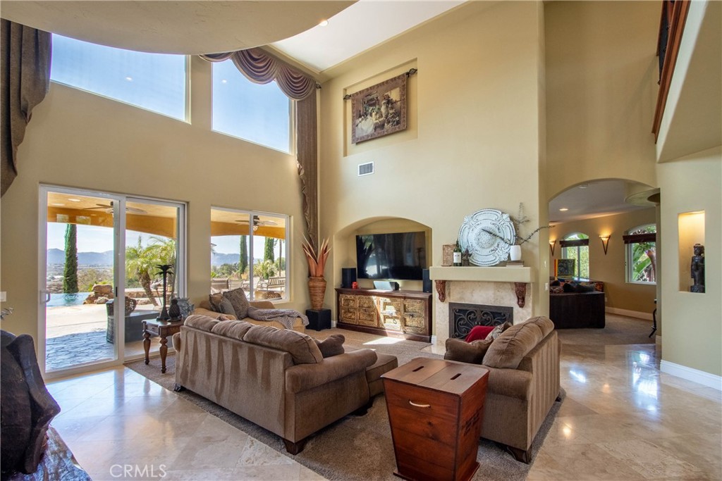 35445 Linda Rosea Road Temecula, CA 92592 - Photo 5 of 21 a living room with fireplace furniture and a fireplace