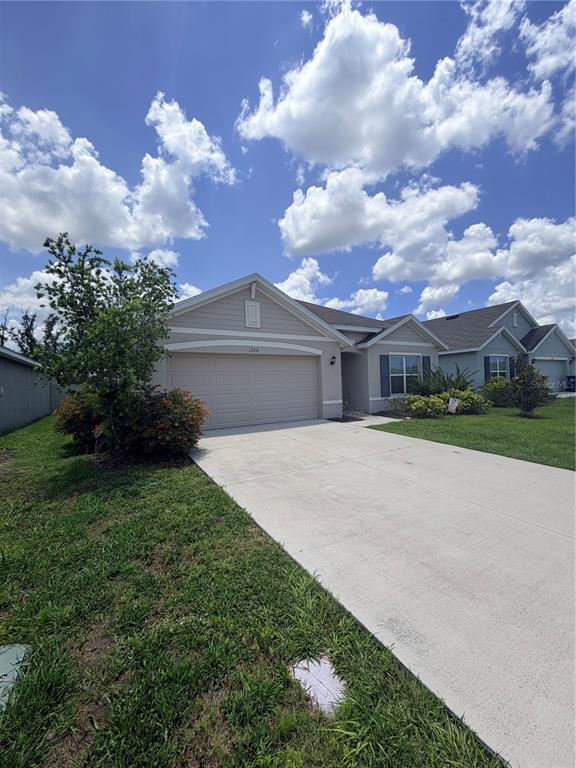 12211 Kingsley Trail Parrish, FL 34219 - Photo 2 of 28 a front view of house with yard and green space