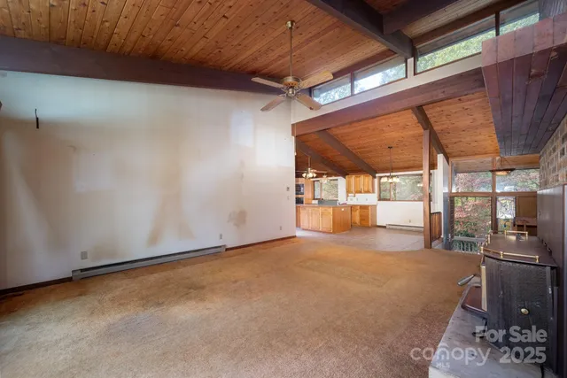 a view of an empty room with a fireplace