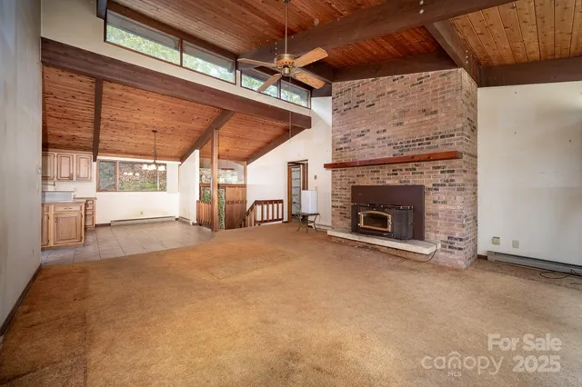 a large kitchen with stainless steel appliances granite countertop a sink a counter space cabinets and stainless steel appliances