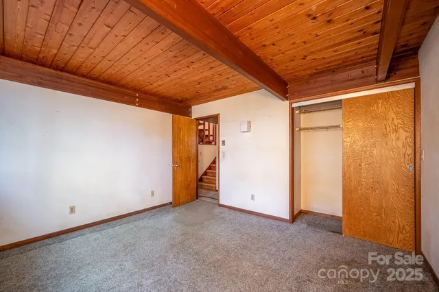 a view of a room with large windows