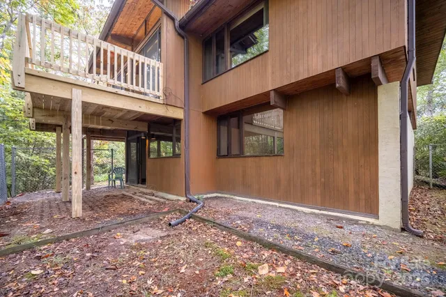 a view of balcony with wooden floor and fence