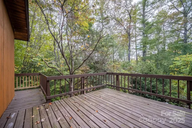 a view of a house with a window and wooden fence