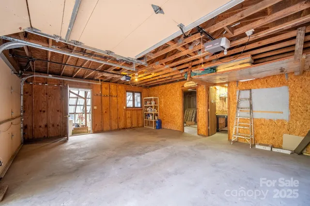 a view of an empty room with a garage