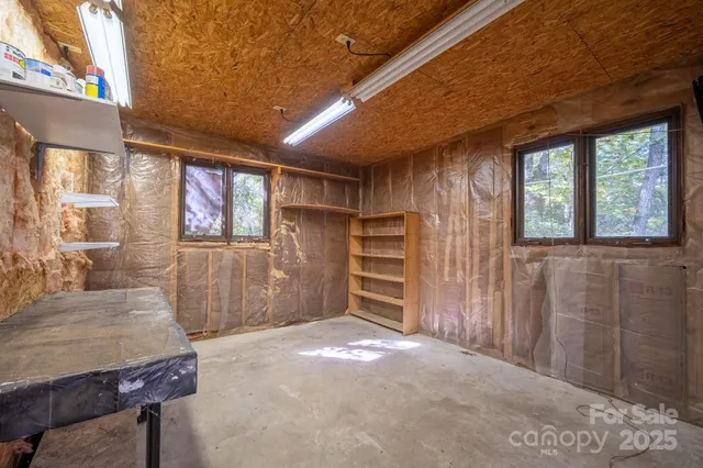 a view of living room with furniture and a window