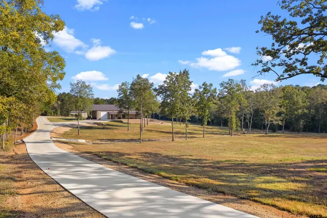 a view of a swimming pool with an outdoor space and seating area
