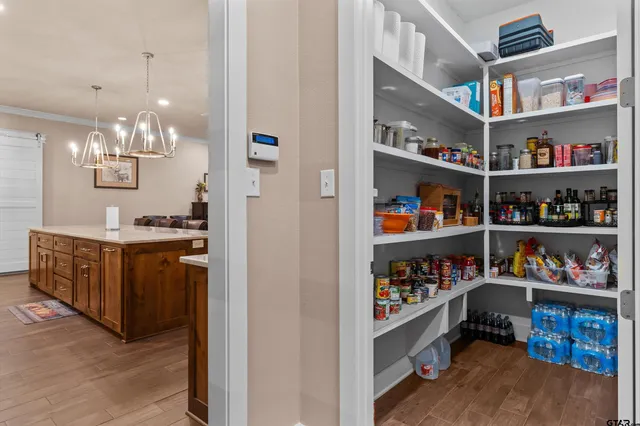 a kitchen with a stove top oven sink and refrigerator