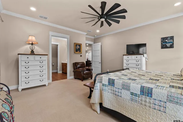 a spacious bathroom with a double vanity sink and a mirror