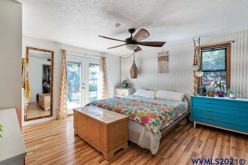 6305 Ruggles Avenue South Salem, OR 97306 - Photo 18 of 42 a bedroom with a bed and wooden floor