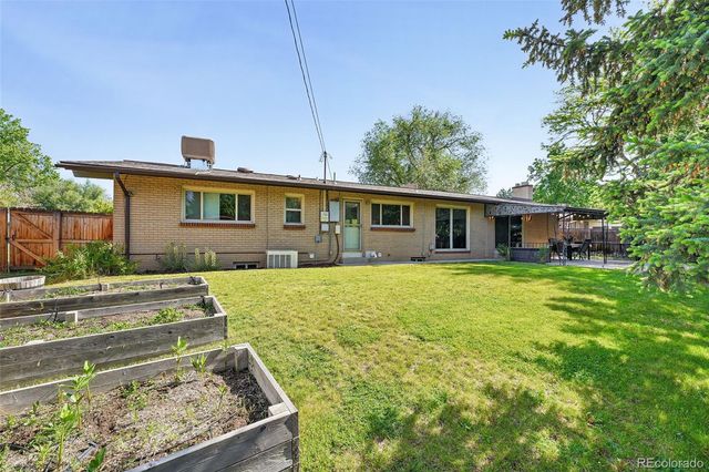 a view of a backyard with a large tree