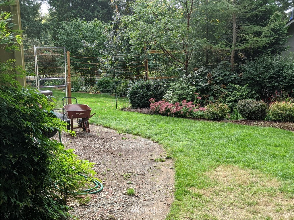 5428 133rd Avenue Southwest Rochester, WA 98579 - Photo 11 of 21 a view of a chair and table in the garden