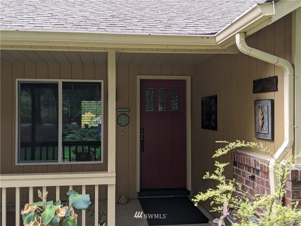 5428 133rd Avenue Southwest Rochester, WA 98579 - Photo 13 of 21 a front view of a house with a porch