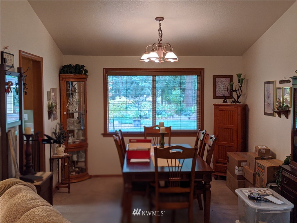 5428 133rd Avenue Southwest Rochester, WA 98579 - Photo 14 of 21 a view of a dining room with furniture window and outside view