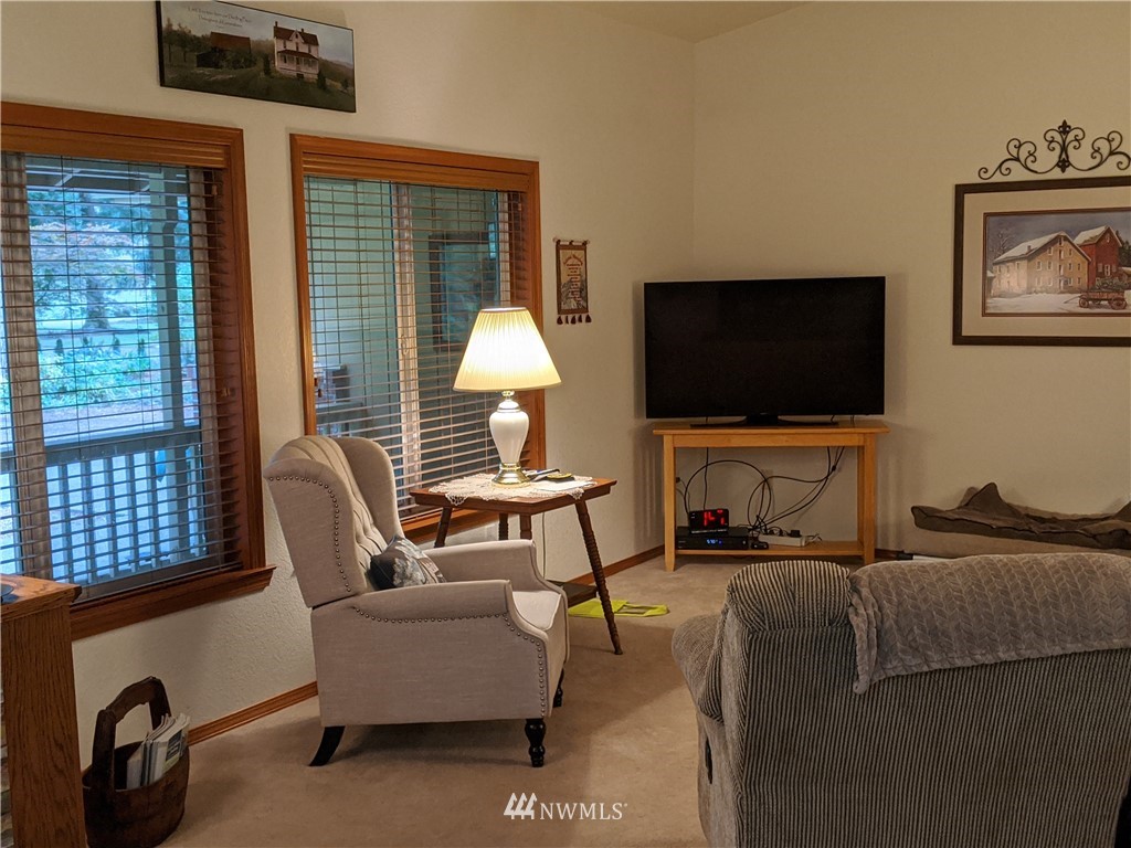 5428 133rd Avenue Southwest Rochester, WA 98579 - Photo 15 of 21 a living room with furniture and a flat screen tv