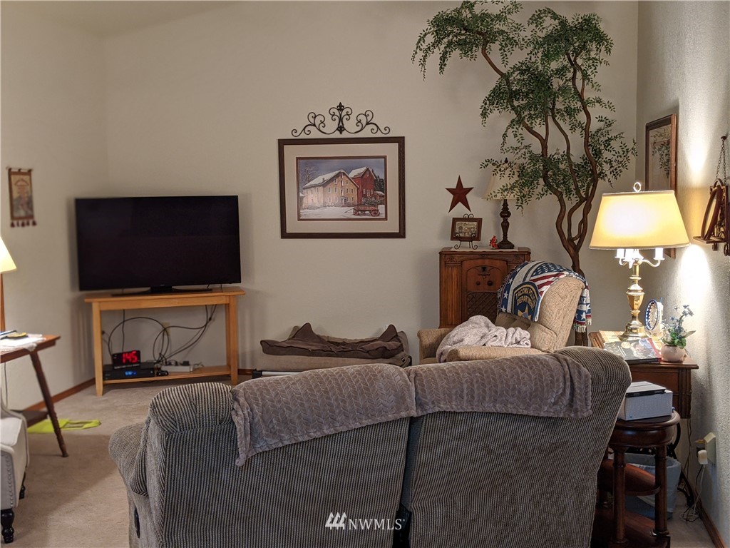 5428 133rd Avenue Southwest Rochester, WA 98579 - Photo 16 of 21 a living room with furniture and a flat screen tv