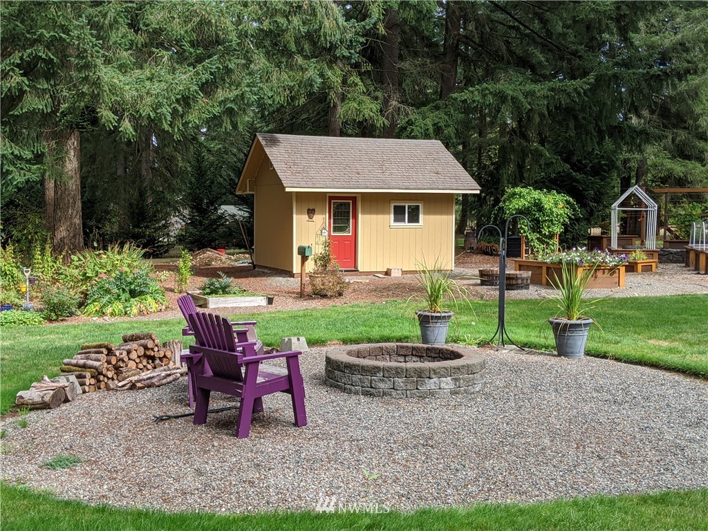 5428 133rd Avenue Southwest Rochester, WA 98579 - Photo 8 of 21 a view of a house with backyard and sitting area