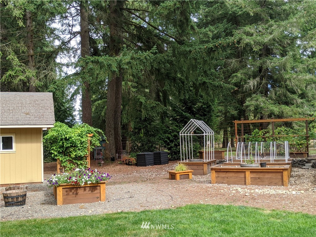 5428 133rd Avenue Southwest Rochester, WA 98579 - Photo 10 of 21 a house view with a sitting space and garden