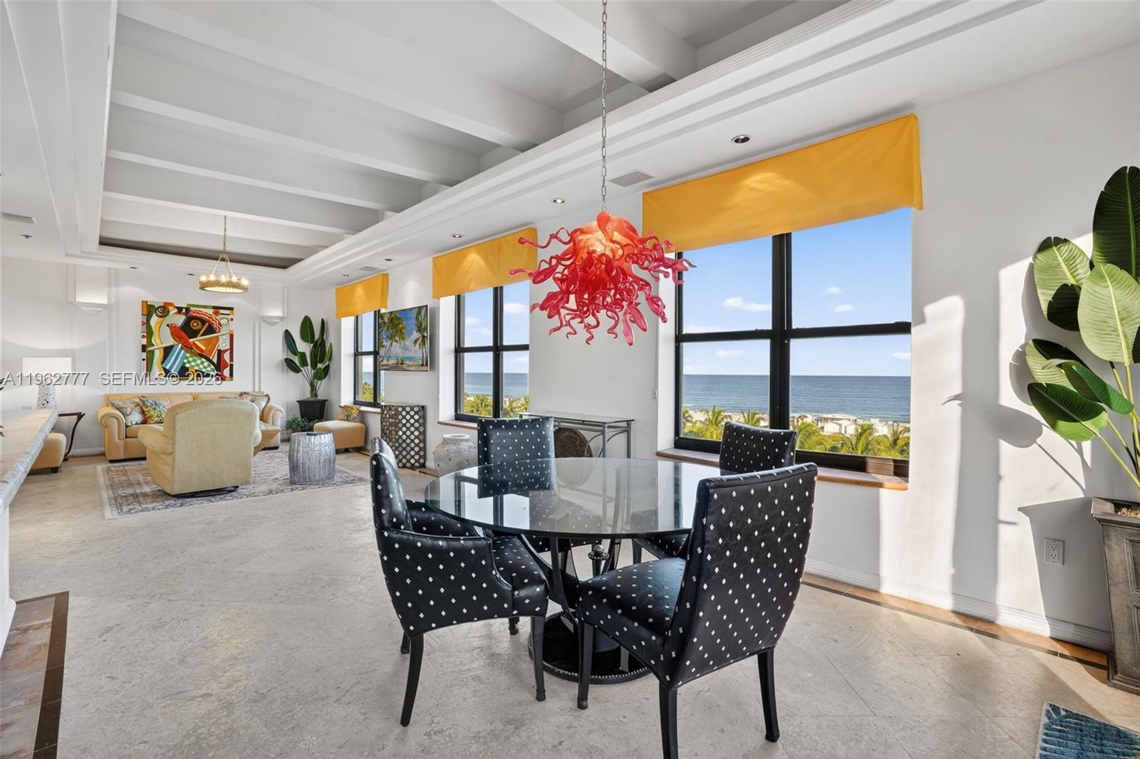 1330 Ocean Drive, Unit R7C Miami Beach, FL 33139 - Photo 10 of 21 a dining room with furniture and a floor to ceiling window