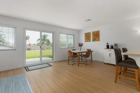 a workspace with furniture window and wooden floor