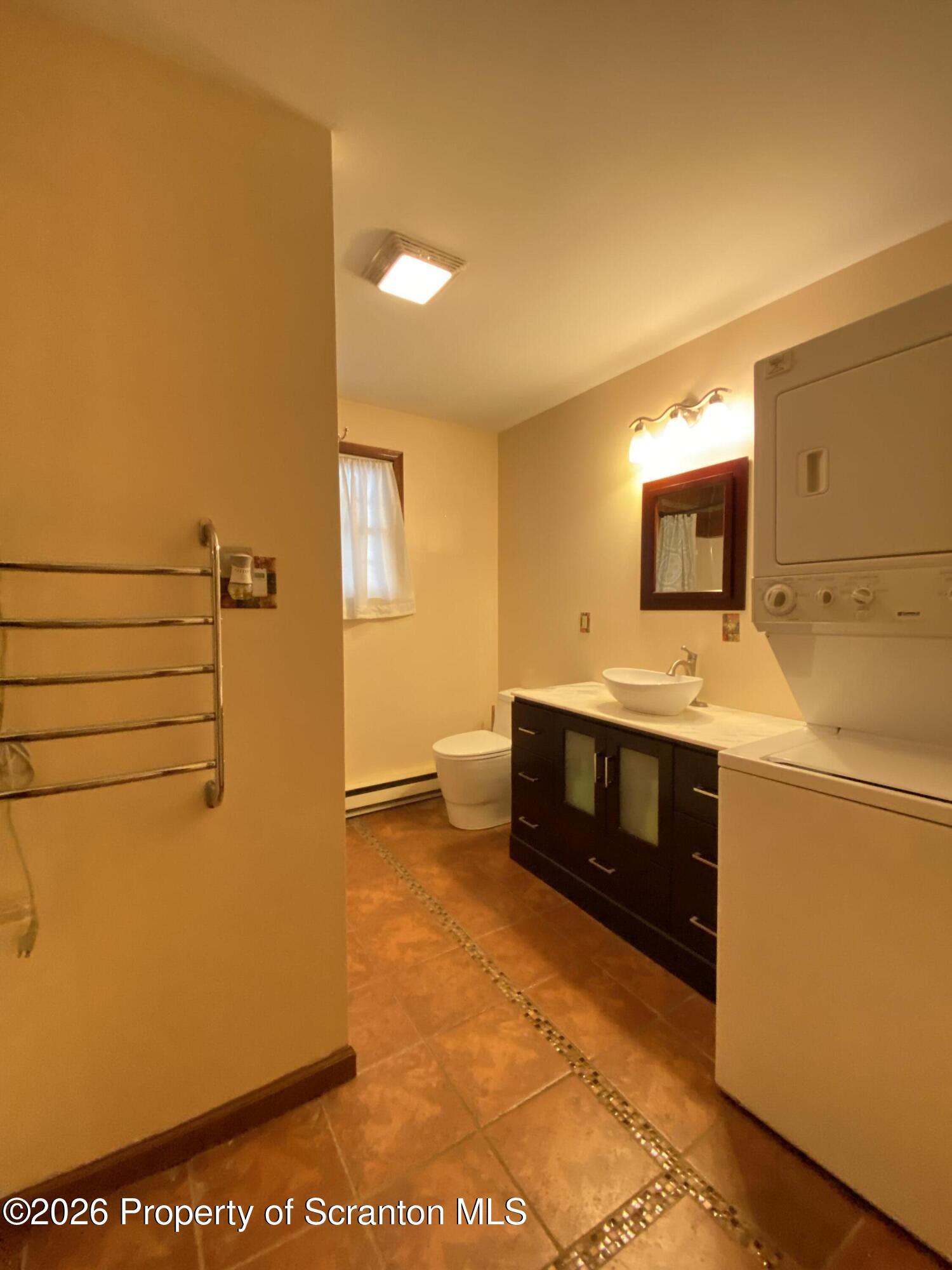 1019 Moosic Street Scranton, PA 18505 - Photo 31 of 43 a bathroom with a sink a vanity and a mirror
