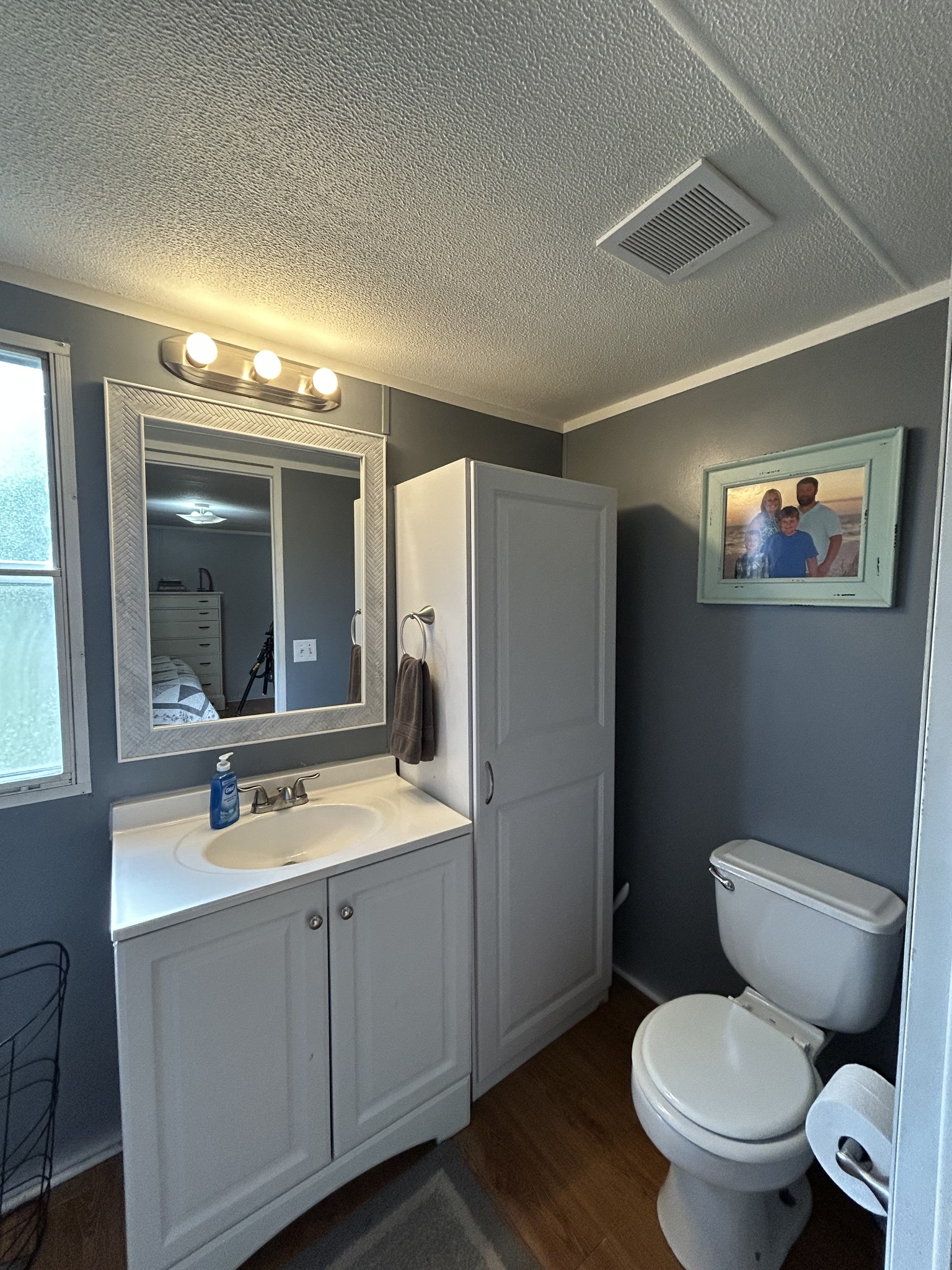 2490 Tackets Branch Road Prospect, TN 38477 - Photo 13 of 42 a bathroom with a toilet sink double vanity and mirror