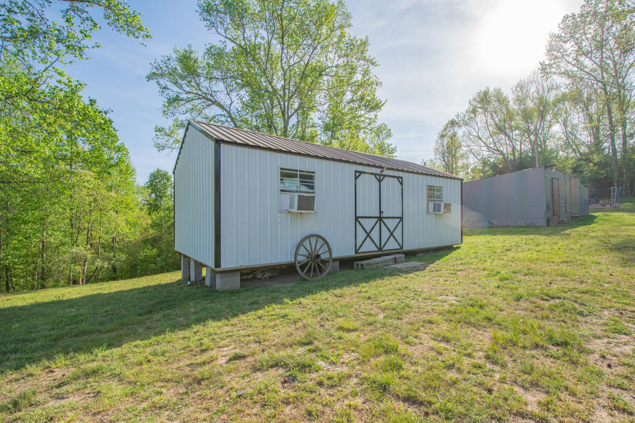 2490 Tackets Branch Road Prospect, TN 38477 - Photo 18 of 42 a backyard of a house with wooden fence and a tree