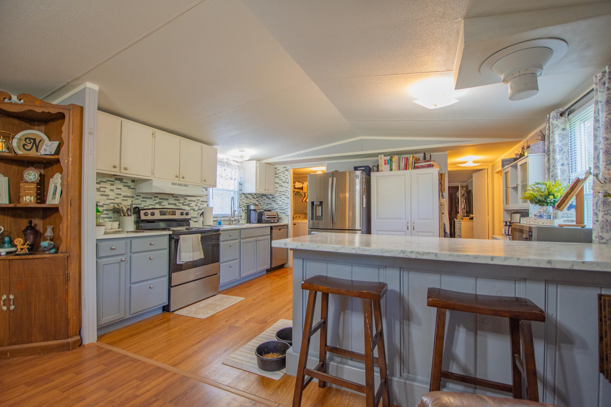 2490 Tackets Branch Road Prospect, TN 38477 - Photo 6 of 42 a kitchen with stainless steel appliances granite countertop a stove a sink and a refrigerator
