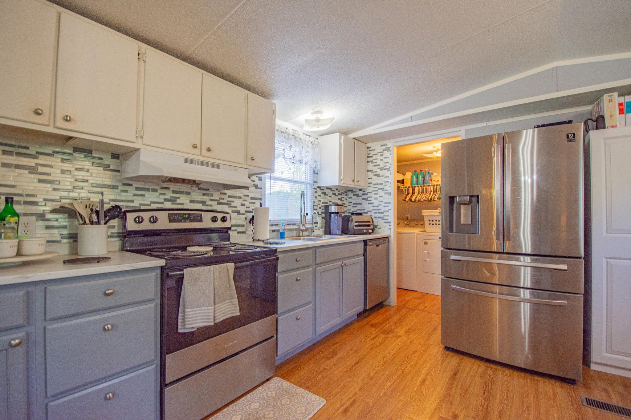2490 Tackets Branch Road Prospect, TN 38477 - Photo 7 of 42 a kitchen with stainless steel appliances granite countertop a refrigerator sink and stove